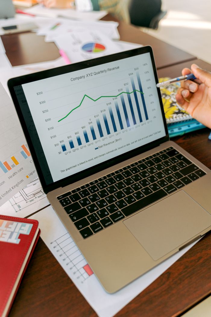 Crafting Captivating Headlines: Your awesome post title goes here A close-up view of a laptop displaying business analytics and revenue charts.